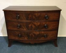 A mahogany four drawer bow front chest. Est. £100