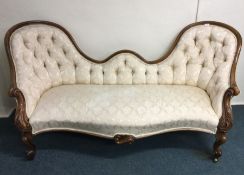 A large Victorian scroll back sofa. Est. £250 - £3