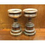 A good pair of turned mahogany urns. Approx. 17 cm