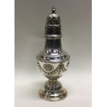 A Victorian chased silver caster. Sheffield 1900. Approx. 206 grams. Est. £150 - £180.