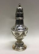 A Victorian chased silver caster. Sheffield 1900. Approx. 206 grams. Est. £150 - £180.