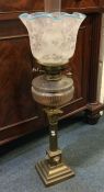 An old oil lamp. Est. £100 - £150.