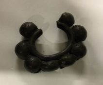 A West African bronze dancer's bracelet. Est. £10