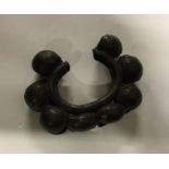 A West African bronze dancer's bracelet. Est. £10