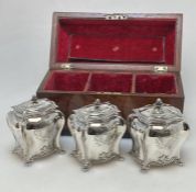 A rare set of three Georgian silver tea caddies at