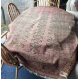 An old rug. Est. £50 - £60.
