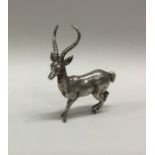 A silver figure of a deer. Possibly Zimbabwean? Approx. 84 grams. Est. £100 - £120.