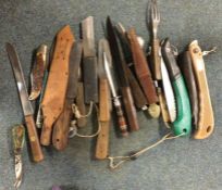 A box containing old knives. Est. £10 - £20.
