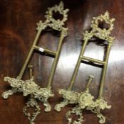 Two brass mounted easels. Est. £20 - £30.