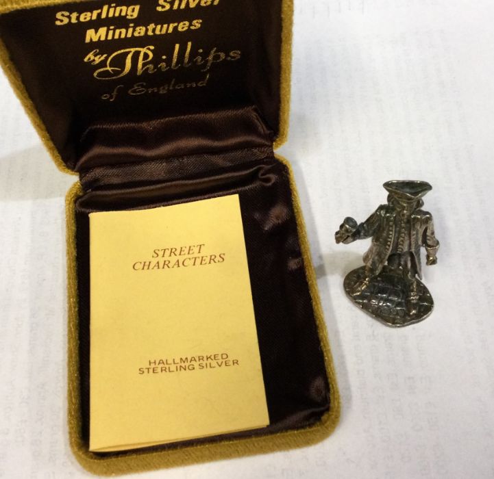 A heavy cased silver figure of the Charles Dickens character ‘Town Crier’. Approx. 32 grams. Est. £
