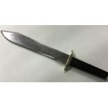 A commemorative Bowie knife engraved with 'Remembe