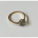 A diamond daisy head cluster ring in 18 carat two