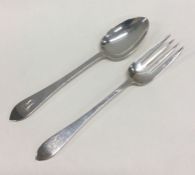 TIFFANY & CO: A silver cased christening spoon and fork. .Approx. 82 grams. Est. £100 - £120.