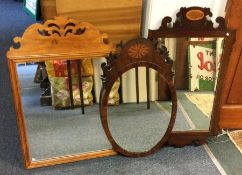 A group of three framed mirrors. Est. £30 - £50.