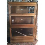 A three section oak Globe Wernicke bookcase. Est.