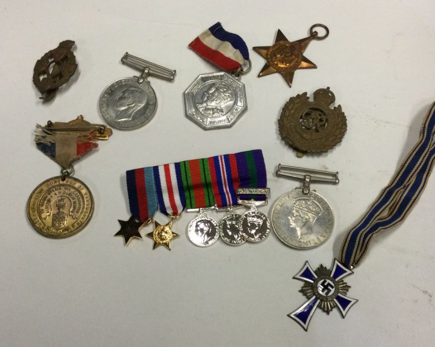 A box containing old dress medals etc. Est. £20 -