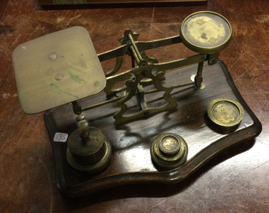 A set of old brass postal scales. Est. £20 - £30.