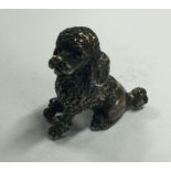 A silver figure of a poodle. Marked to base. Approx.17 grams. Est. £20 - £30.