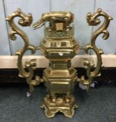 A heavy tall brass two handled centrepiece with el