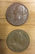 A pair of heavy bronze commemorative medallions. E