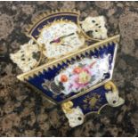 An attractive Coalport letter bracket decorated wi