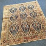 An old patterned rug. Est. £20 - £30.