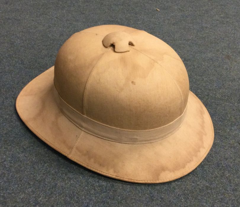 A World War II tropical helmet of Military design.