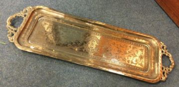 A large Eastern brass two handled tray of rectangu