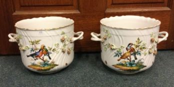 A good pair of Dresden jardinières decorated with