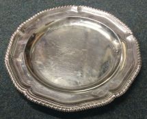 A good George III silver crested dinner plate. London 1767. By Sebastian and James Crespell. Approx.