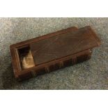 An Antique oak carved snuff box with sliding top.