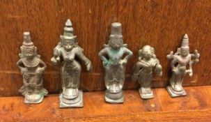 A group of five bronze tribal ladies. Est. £10 - £20.