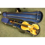 A cased violin together with bows. Est. £30 - £40.