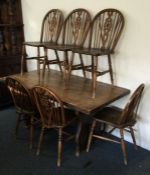 An old oak pub table and chairs. Est. £30 - £40.
