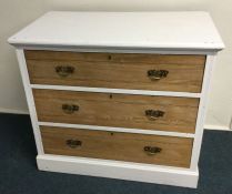 A pine three drawer chest. Est. £30 - £40.