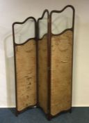 A shaped mahogany three fold screen. Est. £50 - £8