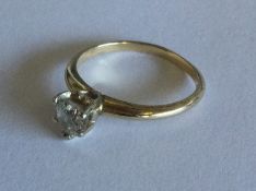 A diamond single stone ring in 18 carat gold claw