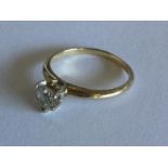 A diamond single stone ring in 18 carat gold claw