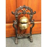 An Oriental brass mounted three bell dinner gong.