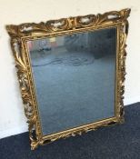 A gilt framed rectangular mirror. Est. £30 - £50.