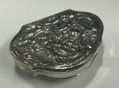 A mid- 18th Century Georgian chased silver snuff box. Maker’s mark ‘EC’ to lid. Approx. 39 grams.