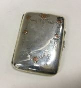 A silver cigarette case with gold inlay. Birmingham 1945. By Smith and Bartlam. Approx. 45 grams.