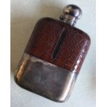 A massive silver and crocodile skin hip flask with