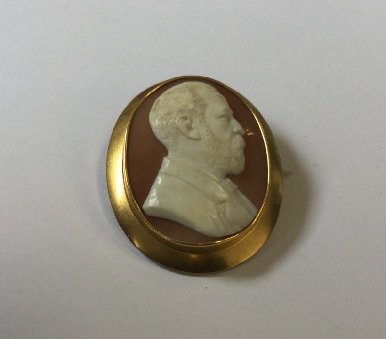 A large oval cameo of a gent in 15 carat gold fram