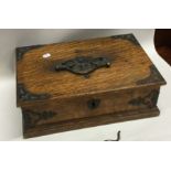 An Edwardian oak hinged top box together with cont