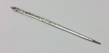 A rare early to mid-17th Century silver needle. Marked to centre. Approx. 8 grams. Est. £300 - £