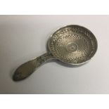 A fine silver caddy spoon with round bowl. Birmingham 1810. By William Pugh. Est. £70 - £80.