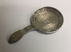 A fine silver caddy spoon with round bowl. Birmingham 1810. By William Pugh. Est. £70 - £80.