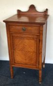 A satinwood single drawer bedside cabinet. Est. £2