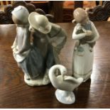 A group of three Lladro figures. Est. £20 - £30.